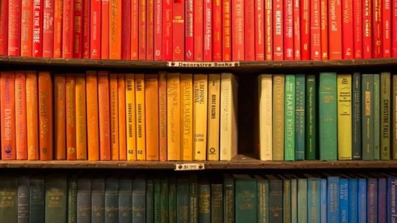 A bookshelf where the books are color- cooridinated