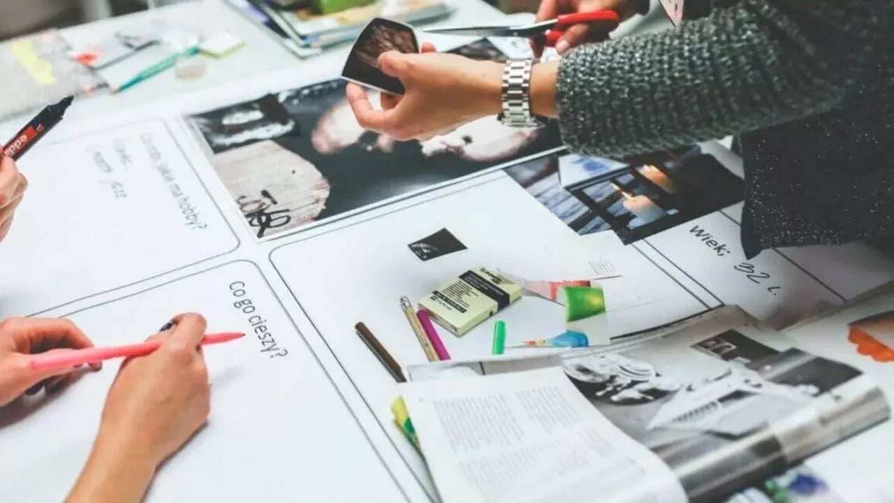 Teamwork on a table full of papers
