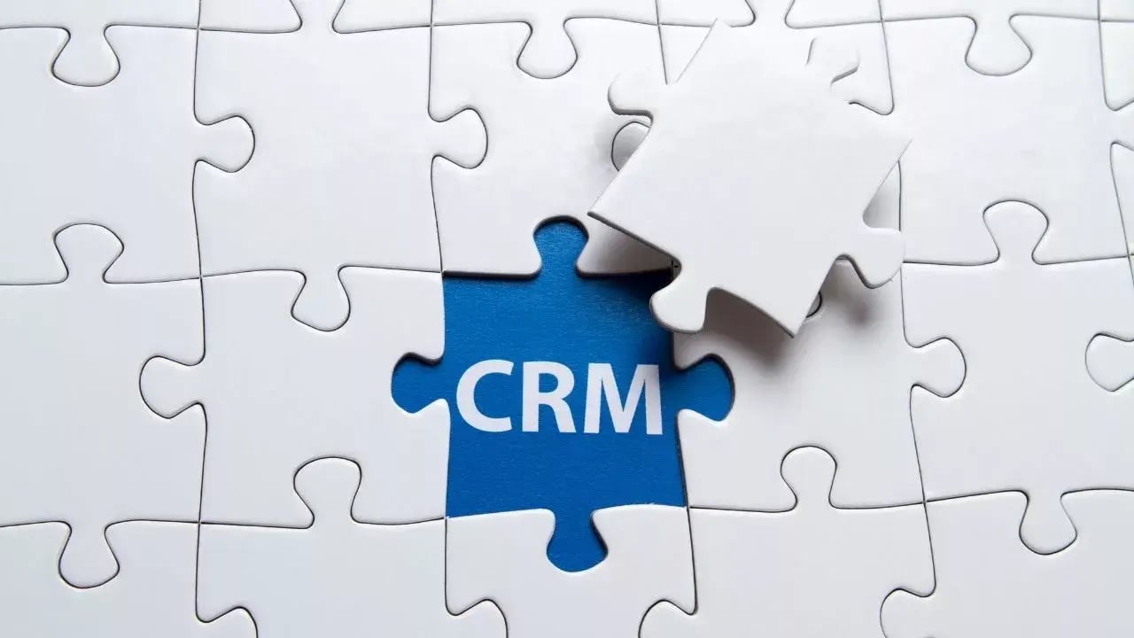 Puzzle with a blue piece that reads crm