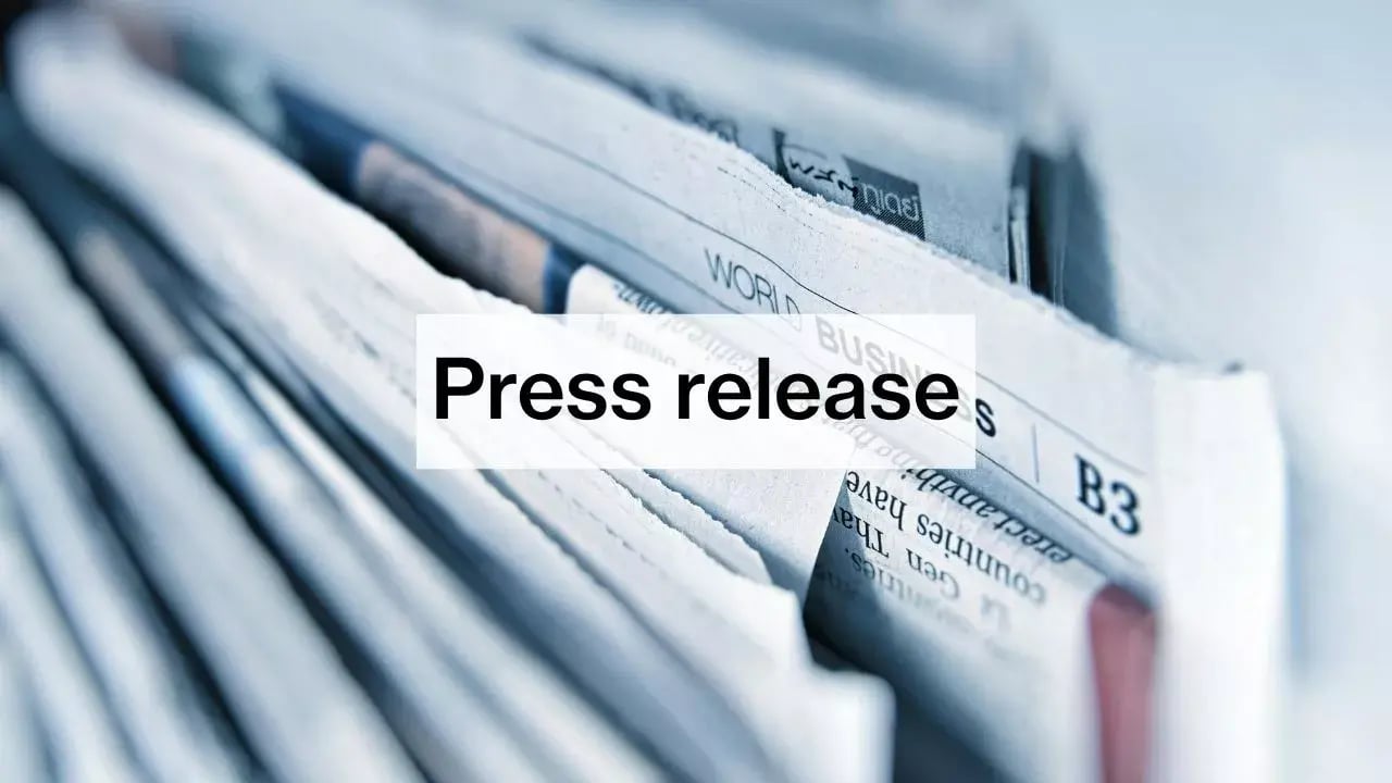 a close-up view of a stack of papers, with a prominent overlay text that reads 