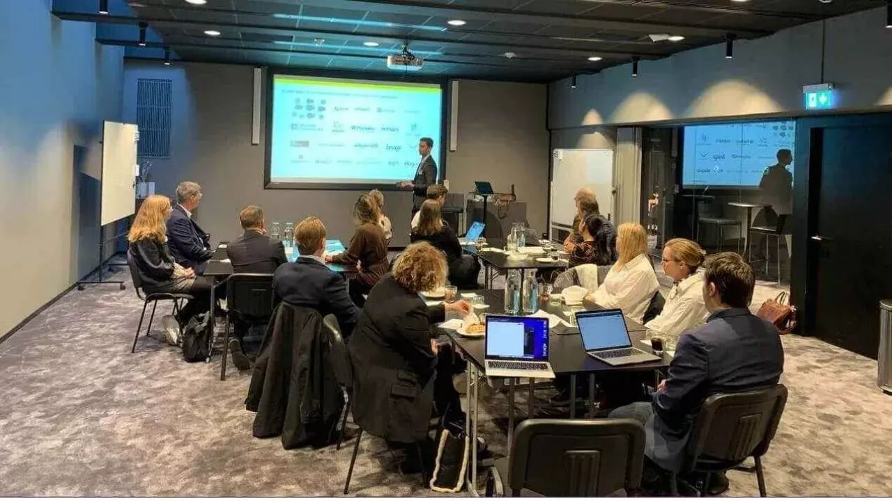 a business meeting or presentation taking place in a modern conference room