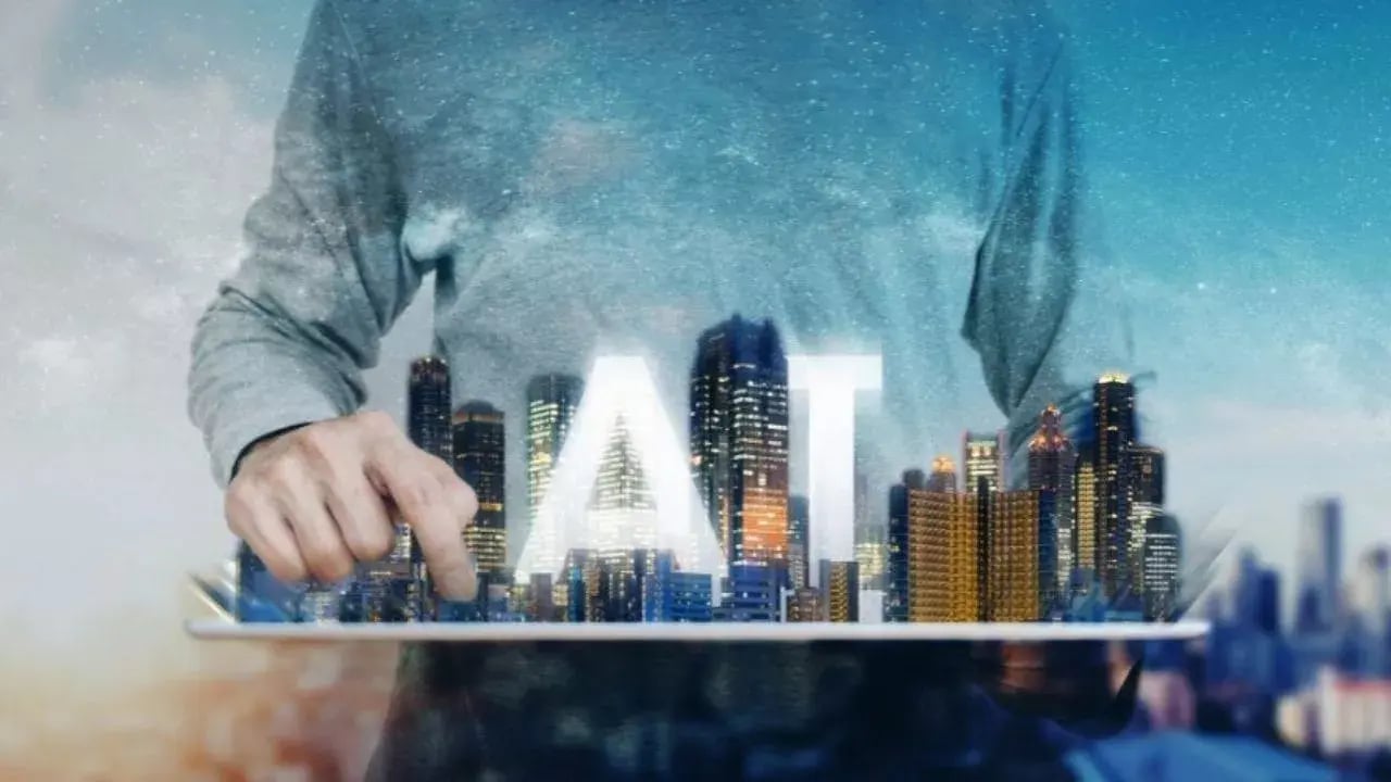 The image depicts a person holding a tablet that displays a futuristic city skyline.