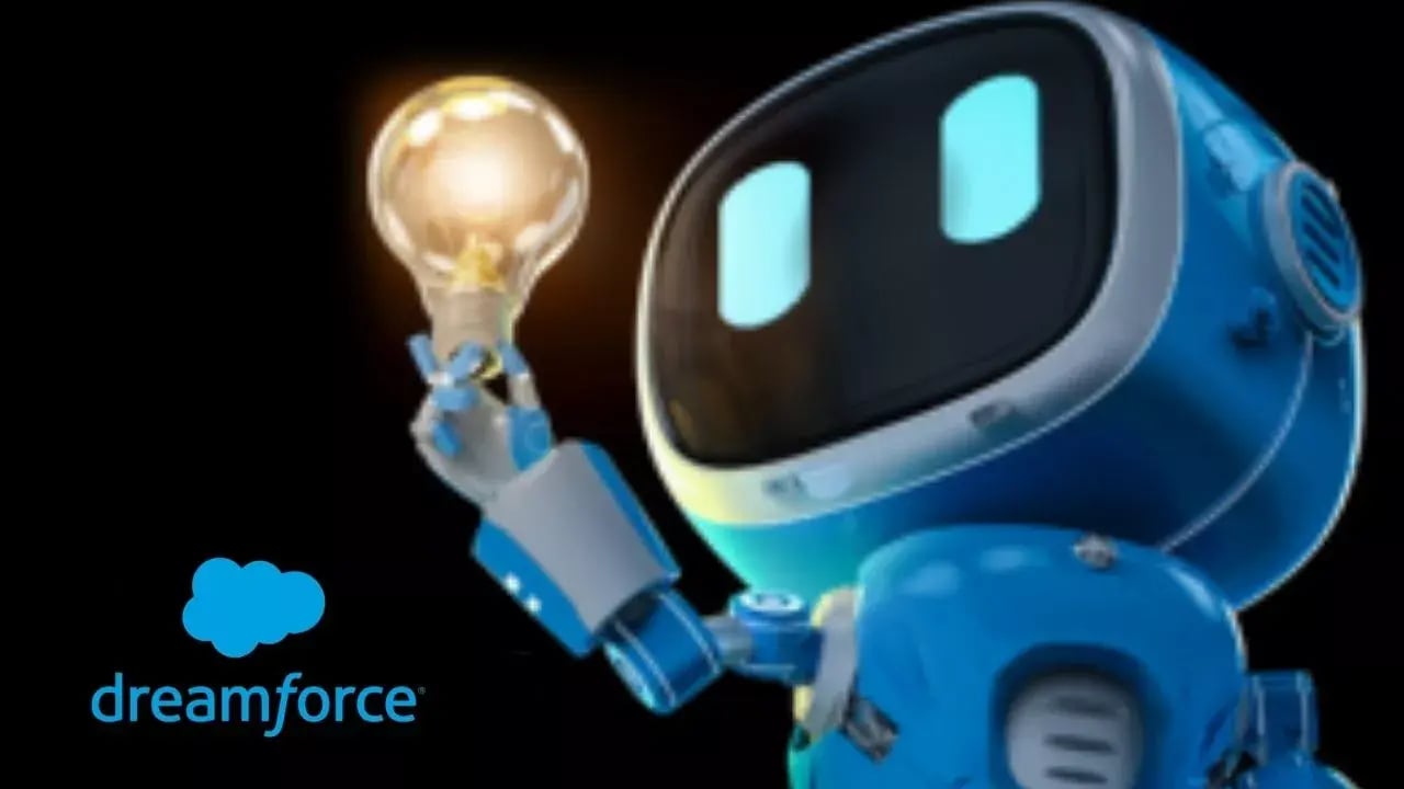 The image features a cartoonish blue robot holding a glowing light bulb